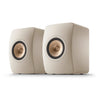 Pair of beige speakers with gold accents, KEF LS50 Meta Bookshelf Speakers
