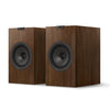 Pair of wooden speakers with black grills, KEF Q3 Meta Bookshelf Speakers